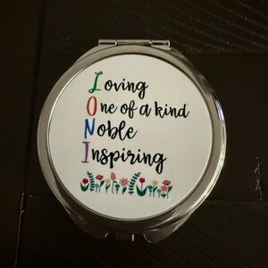 Source Unknown Compact Mirror with Colorful Text